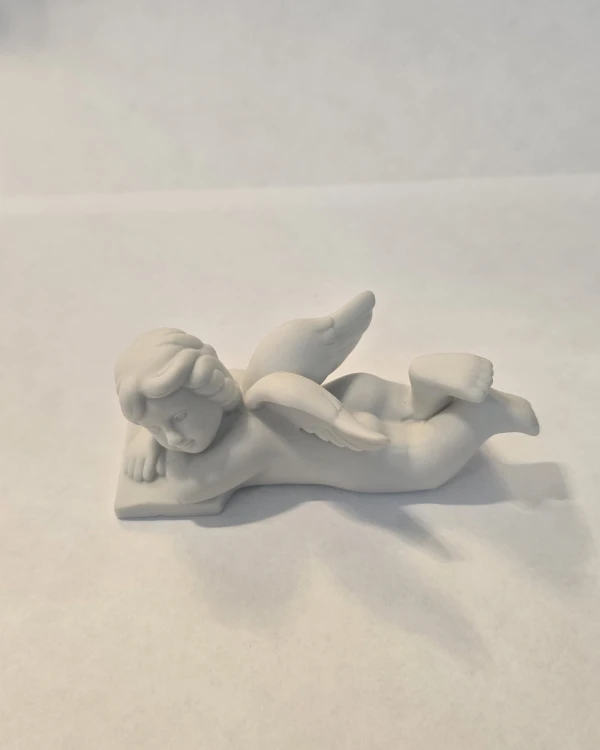 porcelanowy-aniol-lezacy-na-ksiazce-duzy-rosenthal