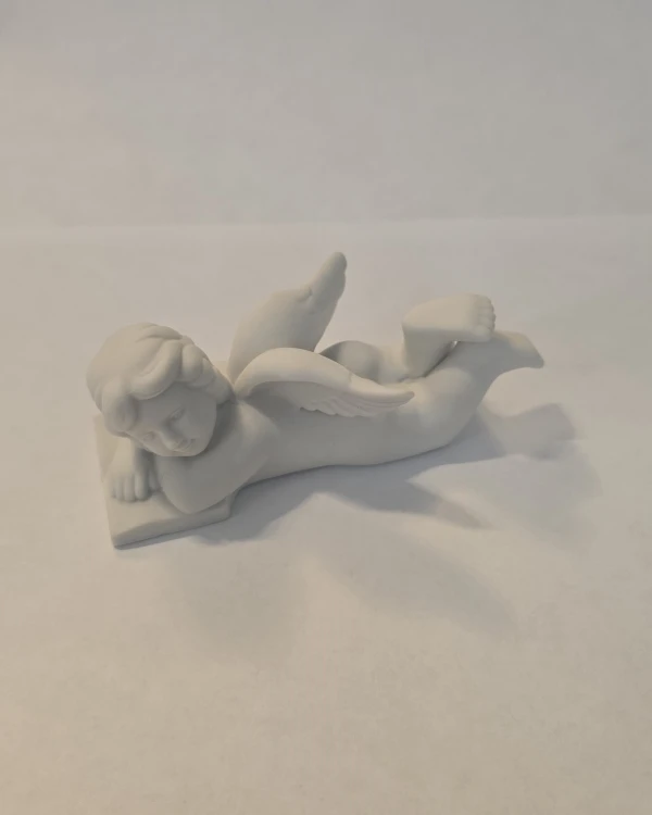 porcelanowy-aniol-lezacy-na-ksiazce-maly-rosenthal-1